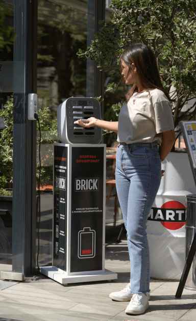 Girl at a 12 slot Brick station